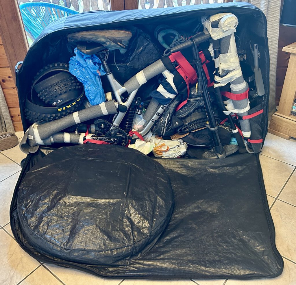 Commencal V5 packed in Evoc bike bag.